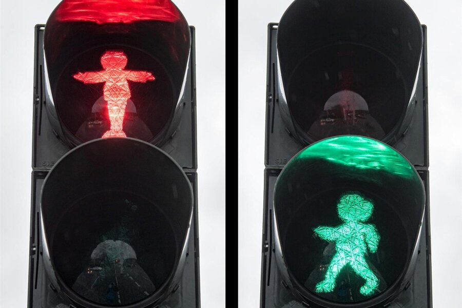 Ausnahmegenehmigung verlängert: Grünes Licht für Vater-und-Sohn-Ampelmännchen in Plauen - Die Vater-und-Sohn-Ampelmännchen: Der Vater mahnt in Rot zum Warten, der Sohn fordert in Grün zum Laufen auf.