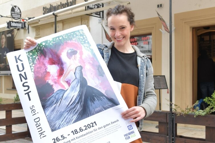 Tonja Arina Gold, Schauspielerin, Produktionsassistentin und Hobbymalerin, stellt ihr Bild "Durch die Nacht" (Acryl auf Leinwand, 30 mal 40 Zentimeter) als Poster im Schaufenster der Stadtwirtschaft Freiberg aus. In der Aktion "Kunst sei Dank!" soll es für einen guten Zweck versteigert werden.