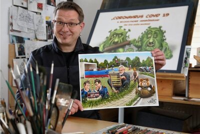 Zugunsten eines Kinder- und Jugendprojektes: Diese Waldenburg-Karikatur wird versteigert - Veit Schenderlein mit der Waldenburg-Karikatur, die nun versteigert wird. 